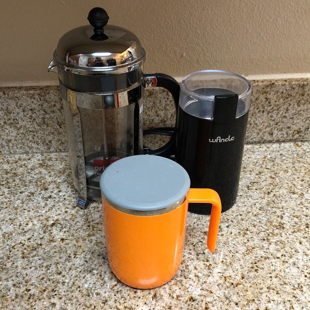 Black Electric Coffee Grinder with French Press and Orange Travel Mug